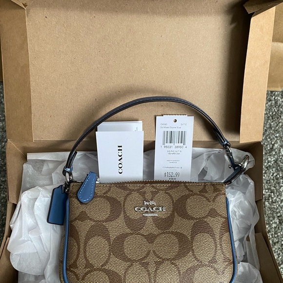 Coach Wristlet NWT. Brand New come with gift box&paper bag. 😊 Price is Firm😊 - Picture 9 of 12